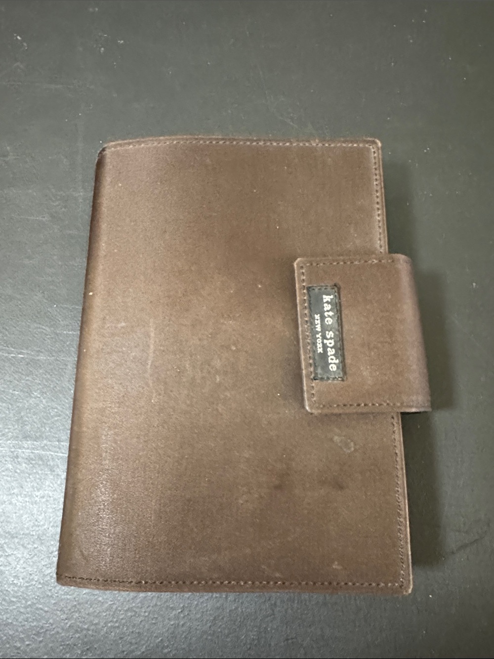 kate spade brown leather passport wallet with snap tab